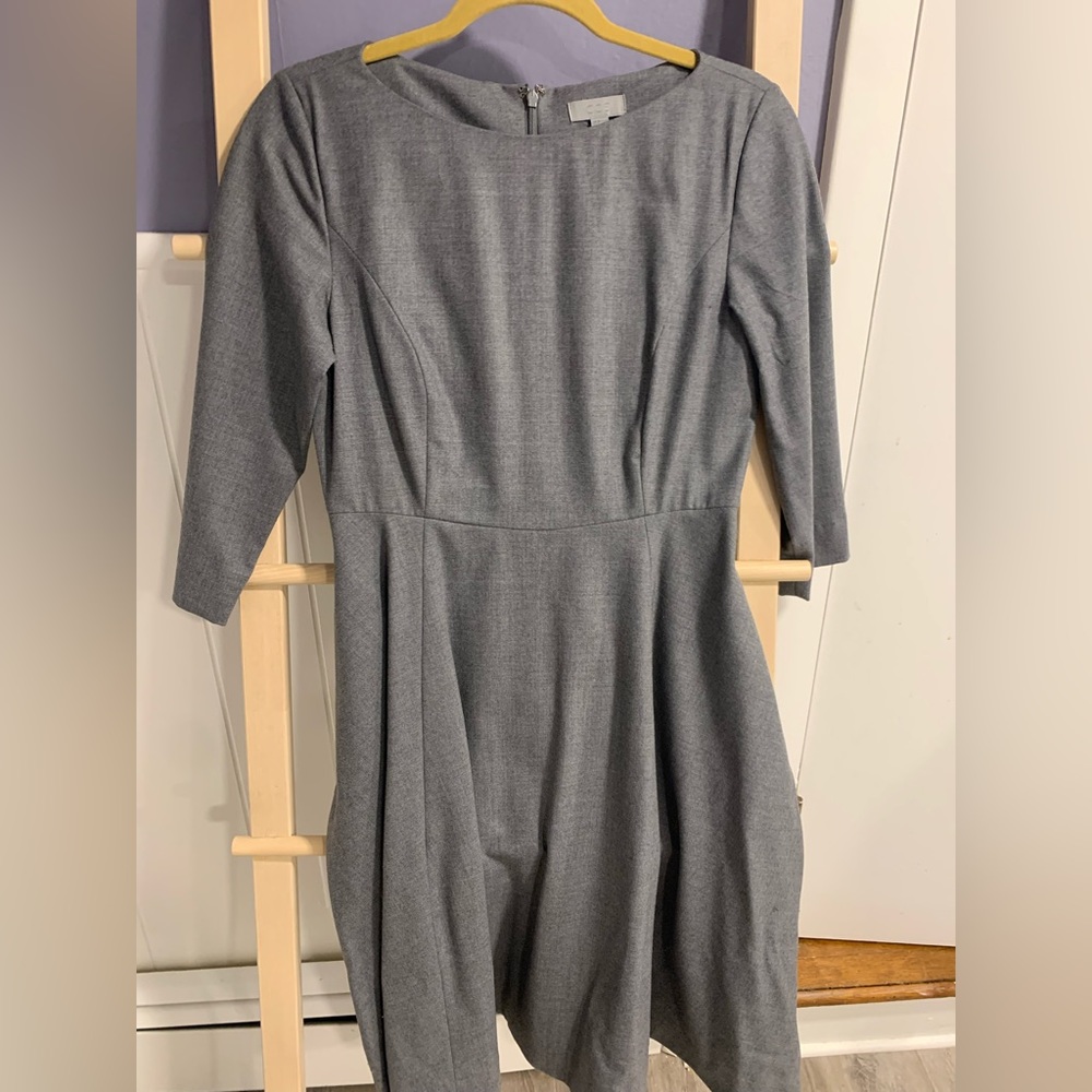 Wool dress with bateau neckline, full skirt and pockets